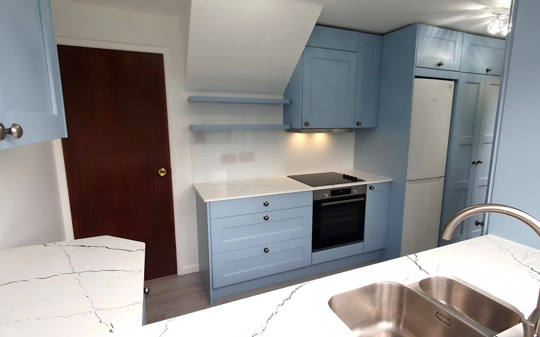 Kesseler blue shaker kitchen with white quartz worktop